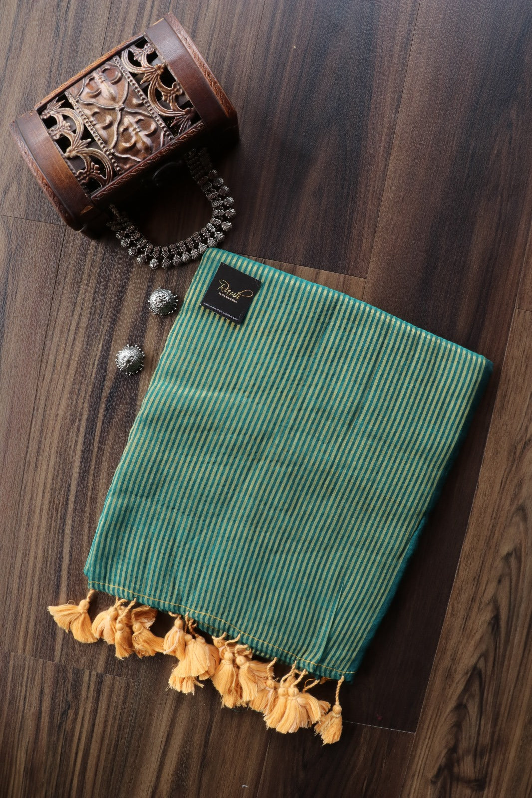PEACOCK GREEN MULMUL DESIGNER SAREE