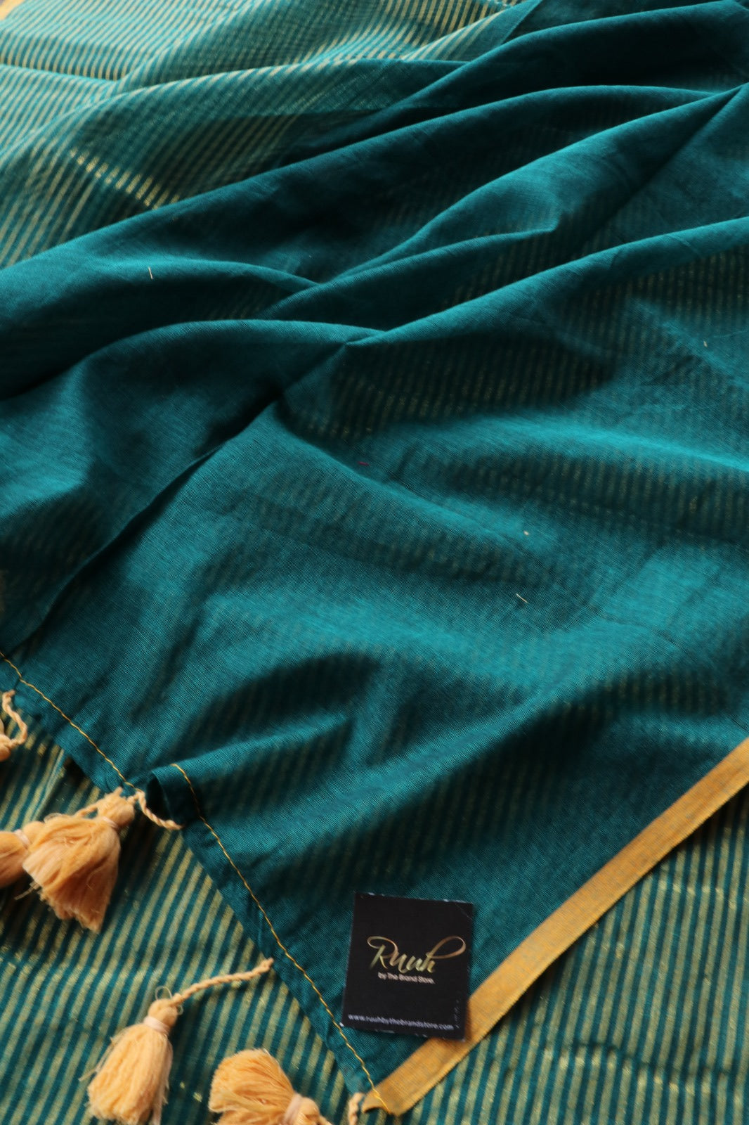 PEACOCK GREEN MULMUL DESIGNER SAREE