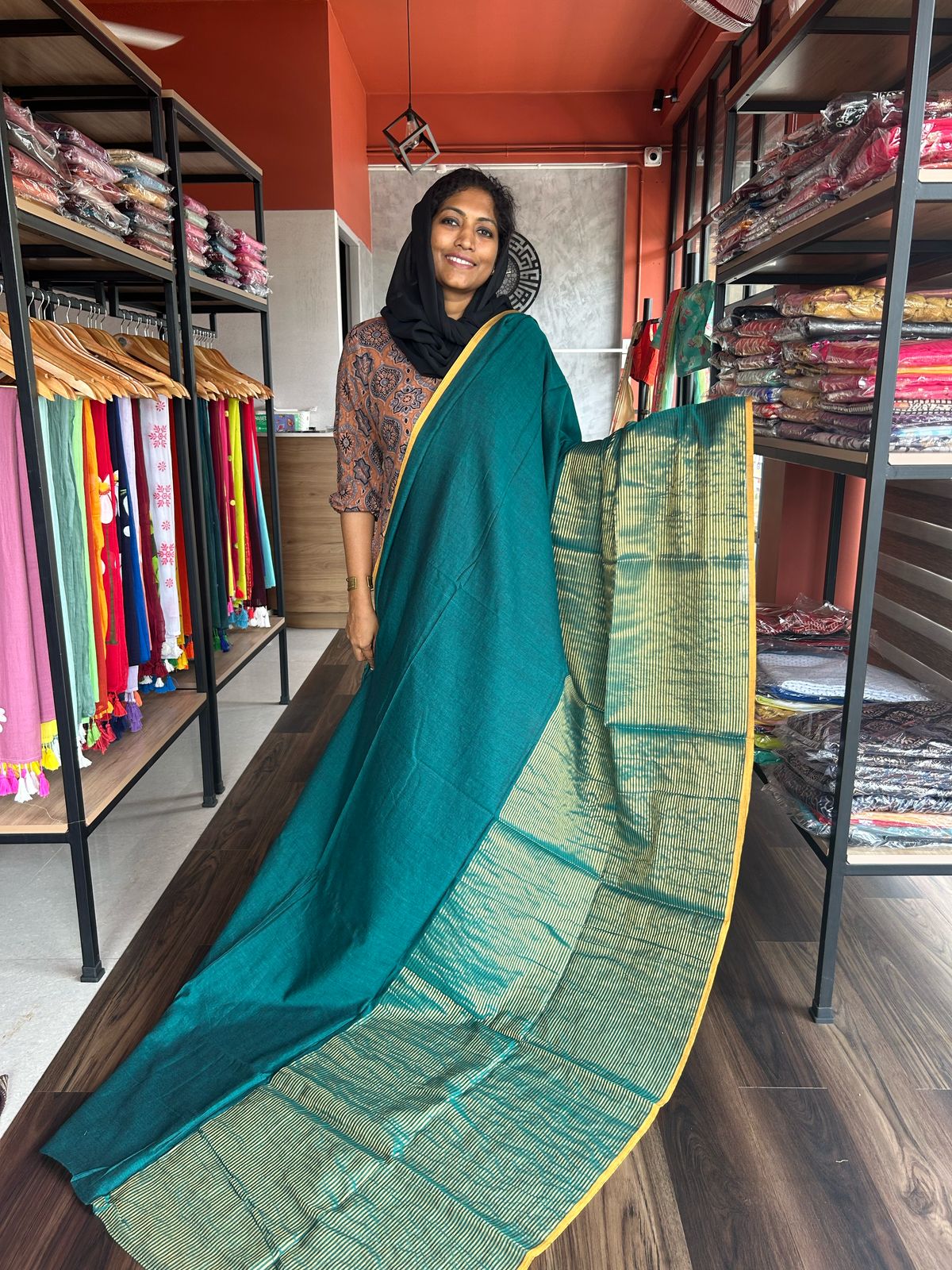 PEACOCK GREEN MULMUL DESIGNER SAREE