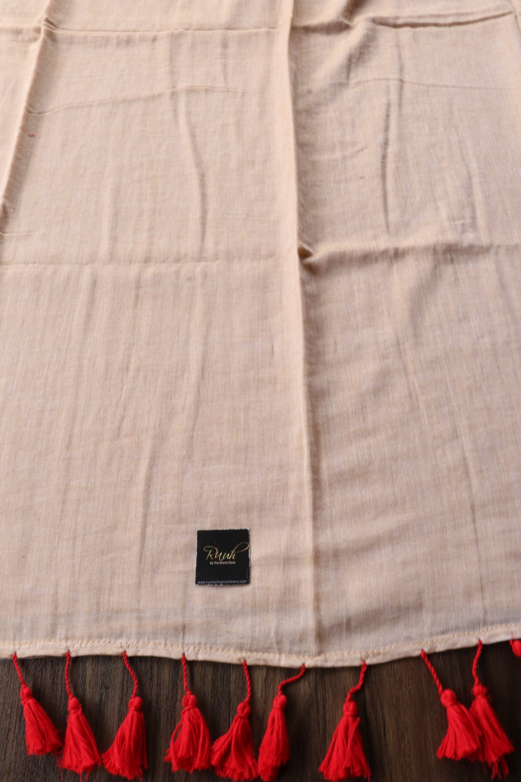 BEIGE MULMUL SAREE WITH RED EDGING