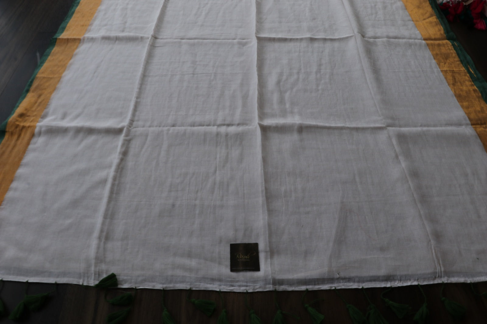 BEIGE MULMUL SAREE WITH GREEN EDGING