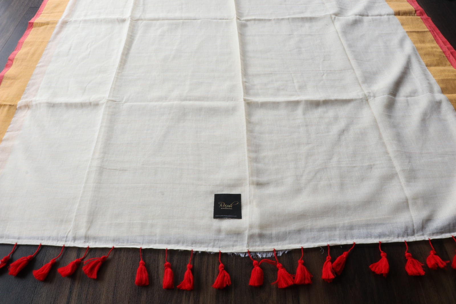 OFF WHITE MULMUL SAREE WITH RED EDGING