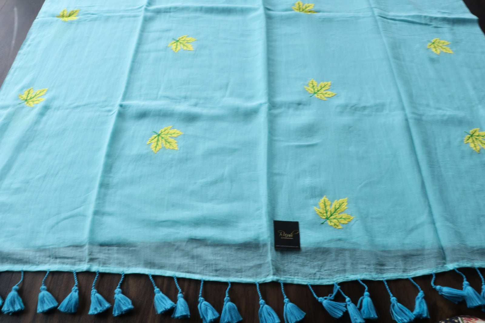 LIGHT BLUE MULMUL SAREE WITH MAPLE LEAF EMBROIDERY