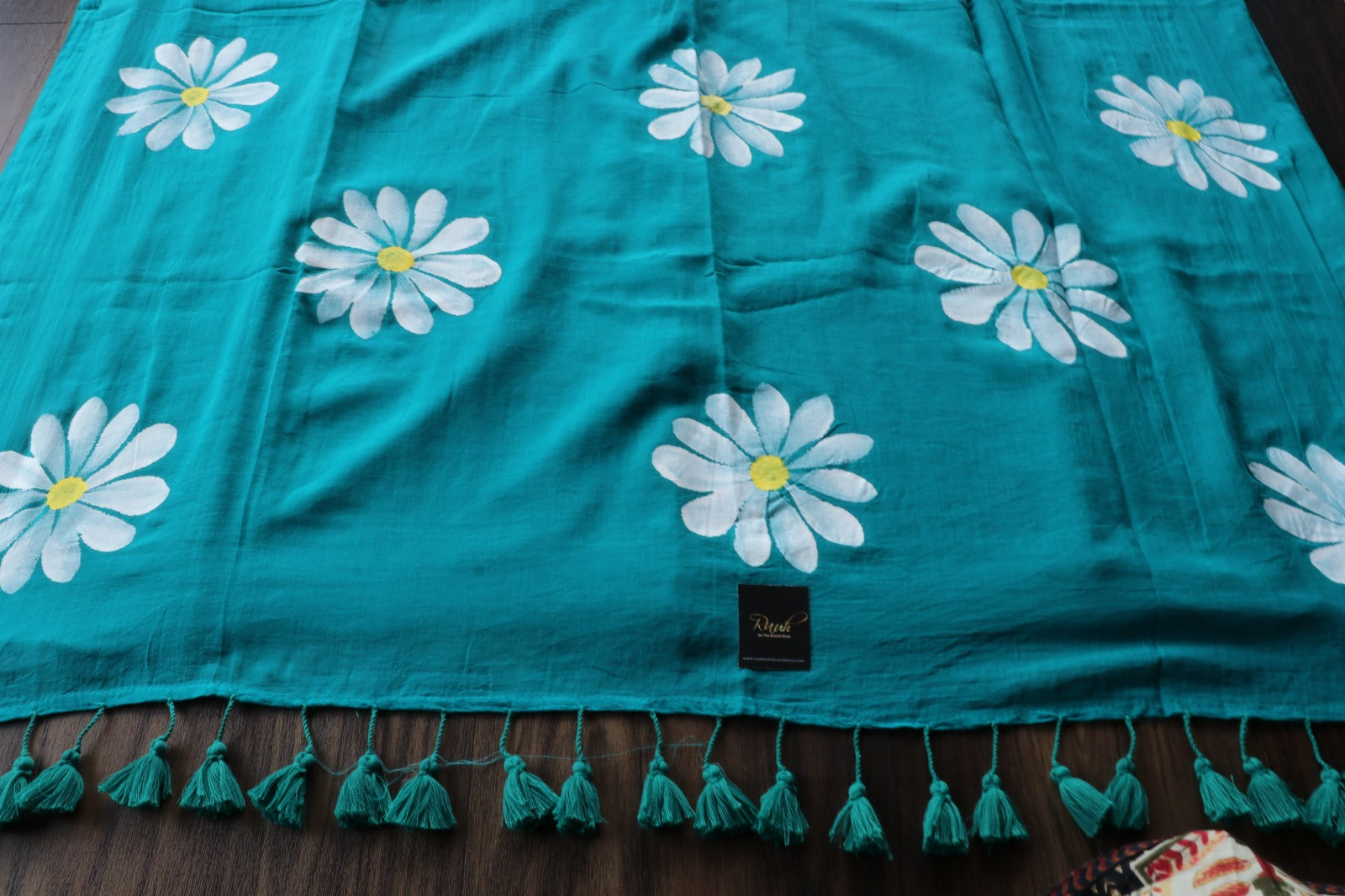 PEACOCK GREEN MULMUL SAREE WITH DAISY HANDPAINT