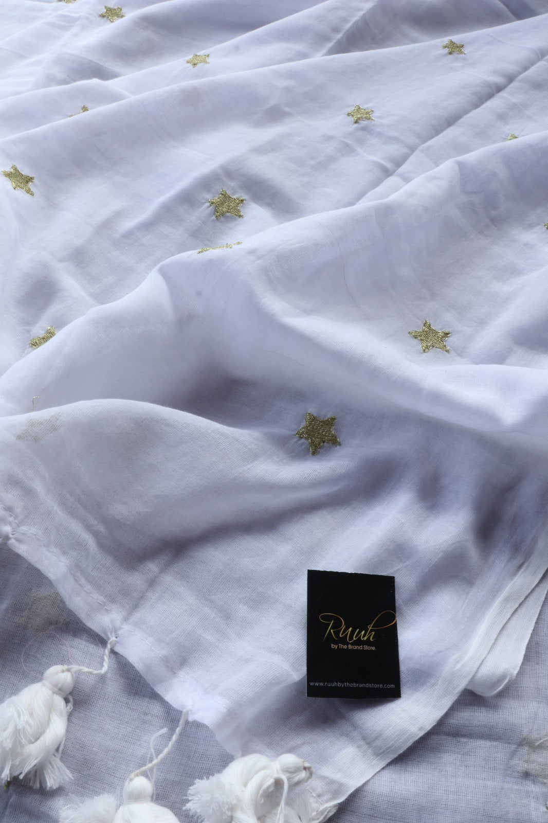 WHITE MULMUL SAREE WITH STAR EMBROIDERY