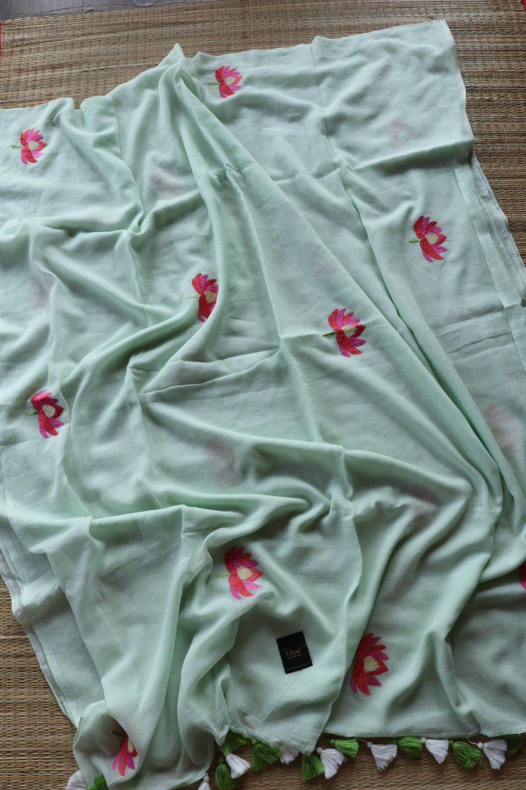 LIGHT PISTA MULMUL SAREE WITH LOTUS EMBROIDERY