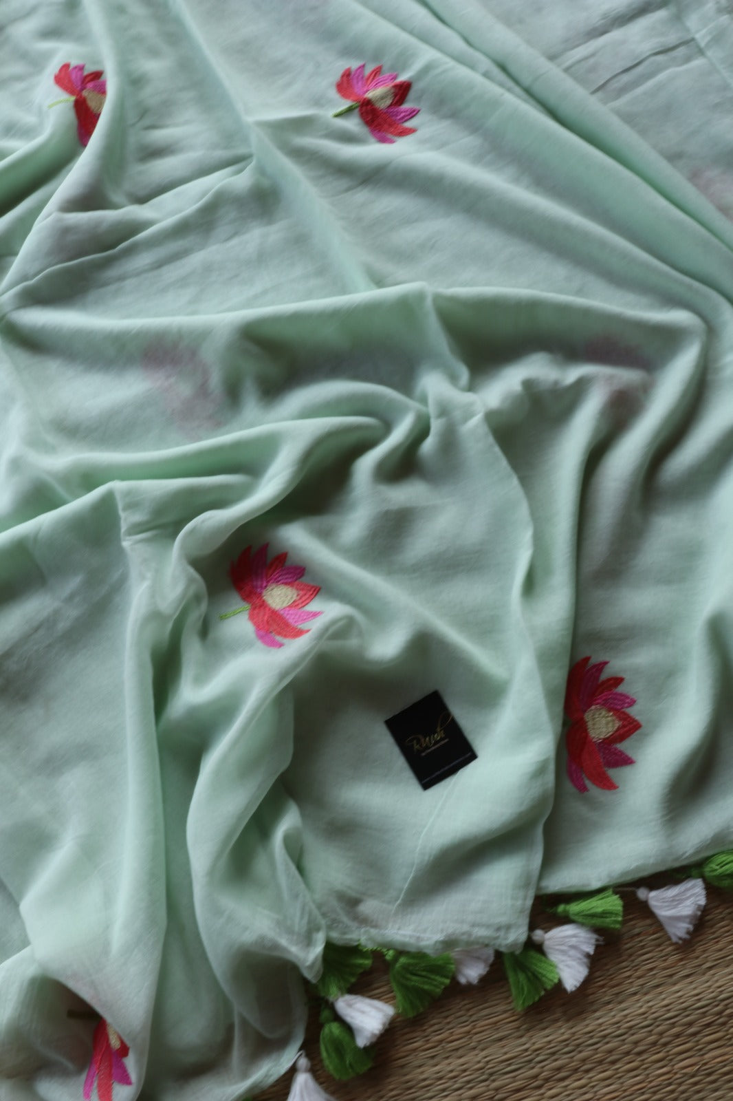 LIGHT PISTA MULMUL SAREE WITH LOTUS EMBROIDERY