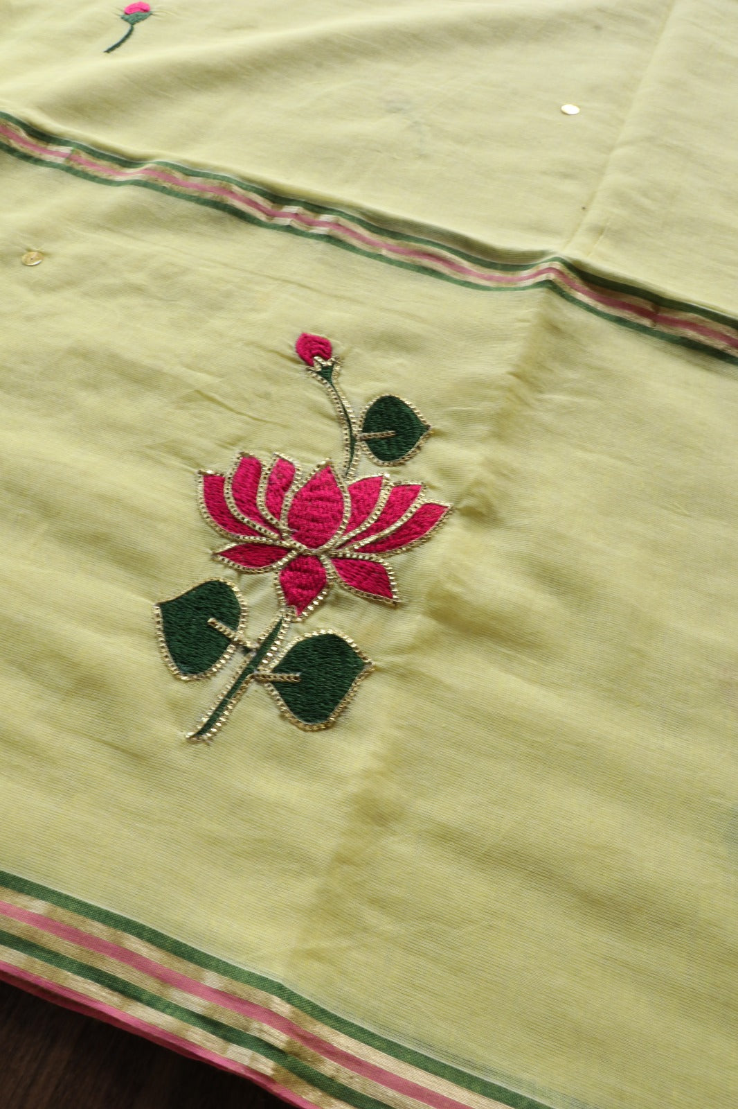 YELLOW MULMUL SAREE WITH LOTUS EMBROIDERY