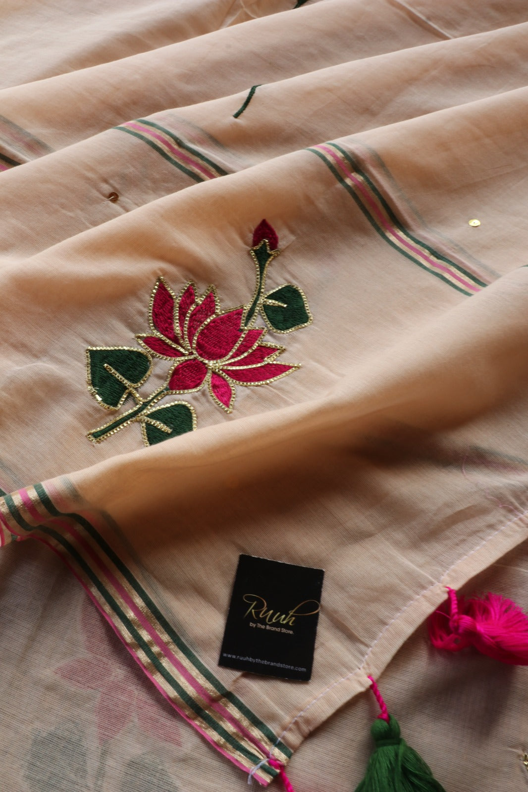 LIGHT BISCUIT MULMUL SAREE WITH LOTUS EMBROIDERY