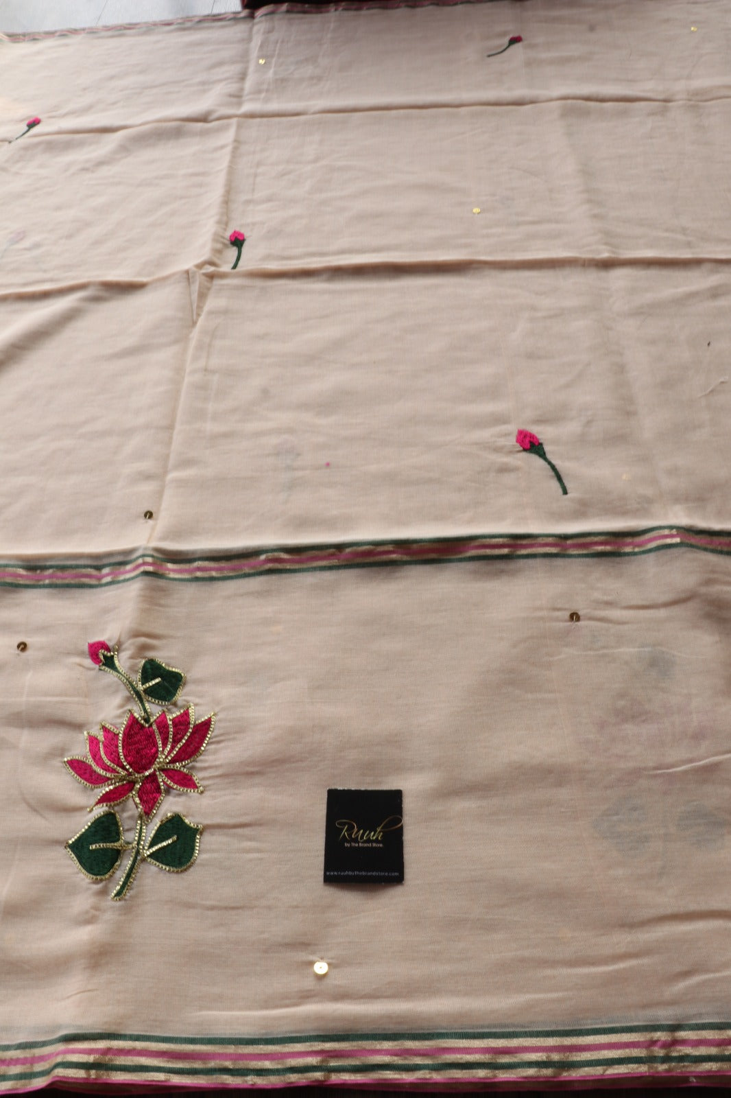 LIGHT BISCUIT MULMUL SAREE WITH LOTUS EMBROIDERY