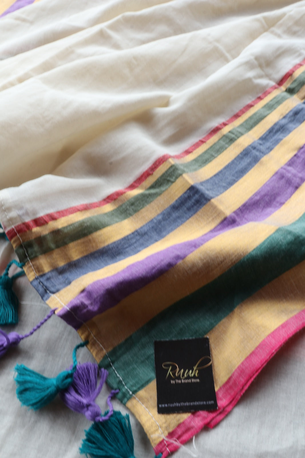 OFF WHITE MULMUL SAREE WITH MULTICOLOUR BORDER