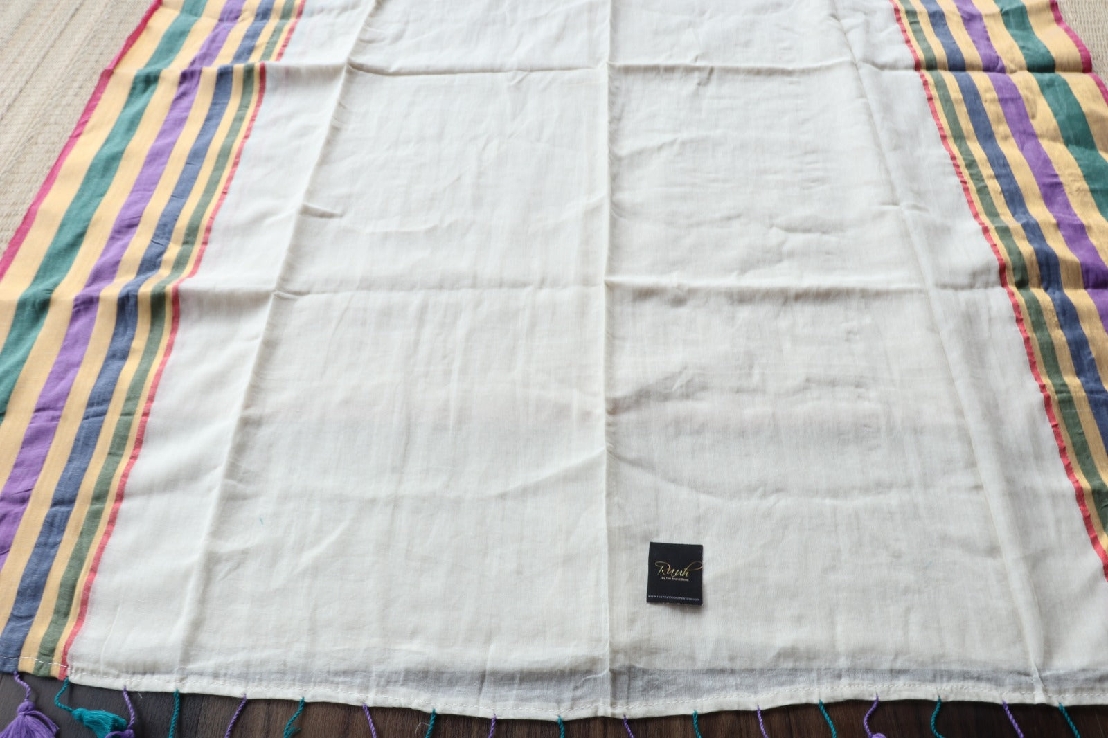 OFF WHITE MULMUL SAREE WITH MULTICOLOUR BORDER