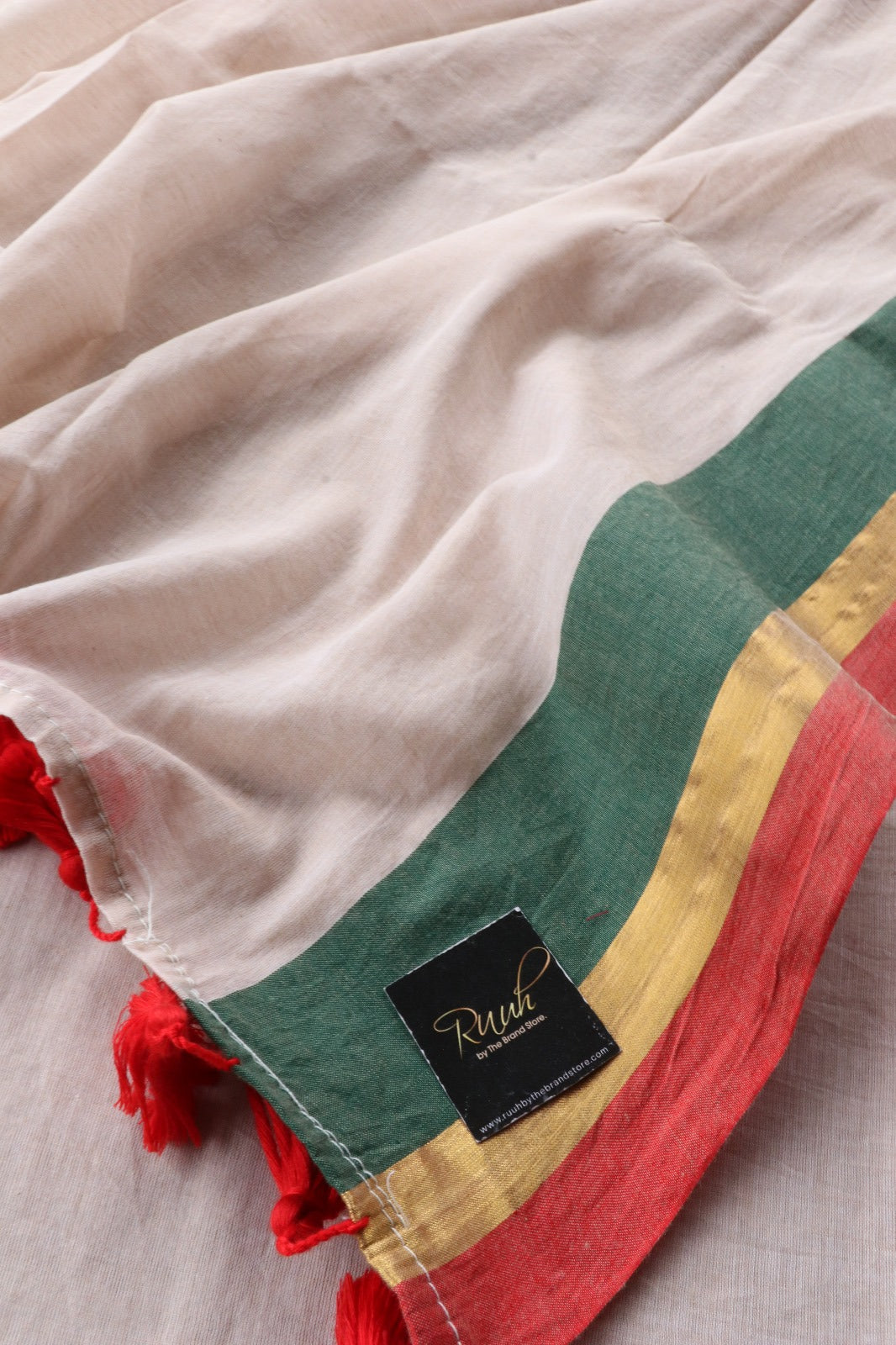 BEIGE MULMUL SAREE WITH TRI COLOUR EDGING