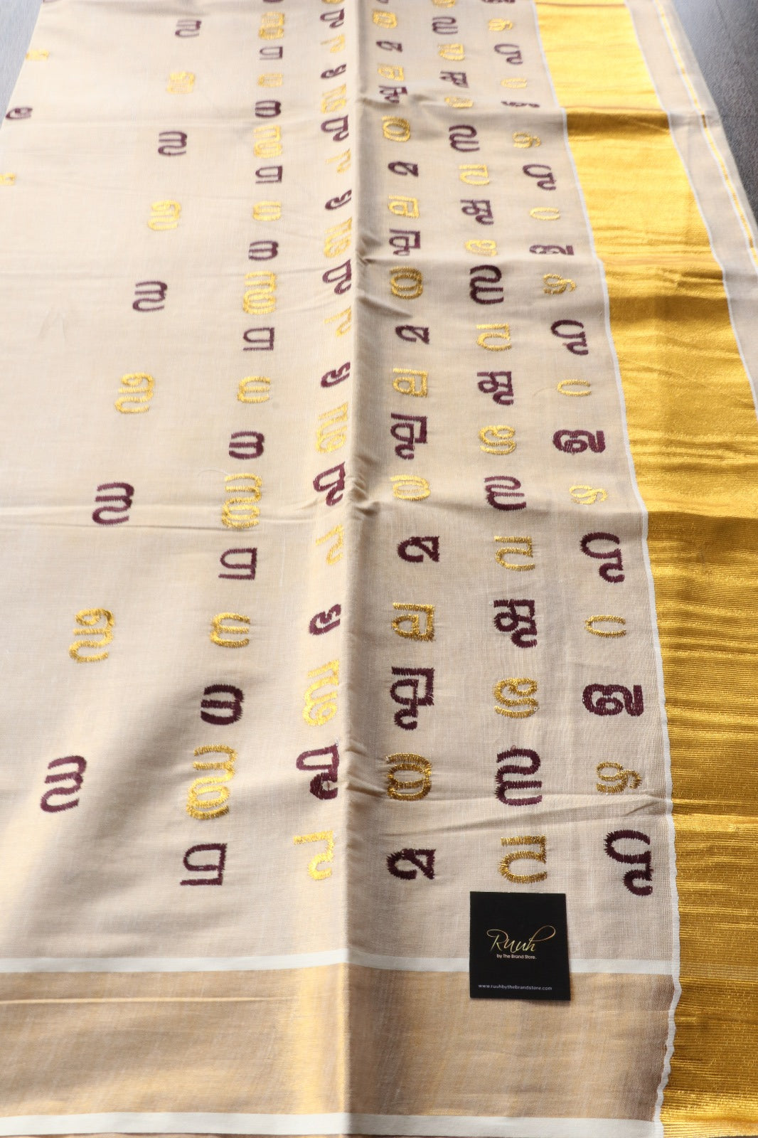 AKSHARAMALA ON KERALA TISSUE -WINE  & GOLD