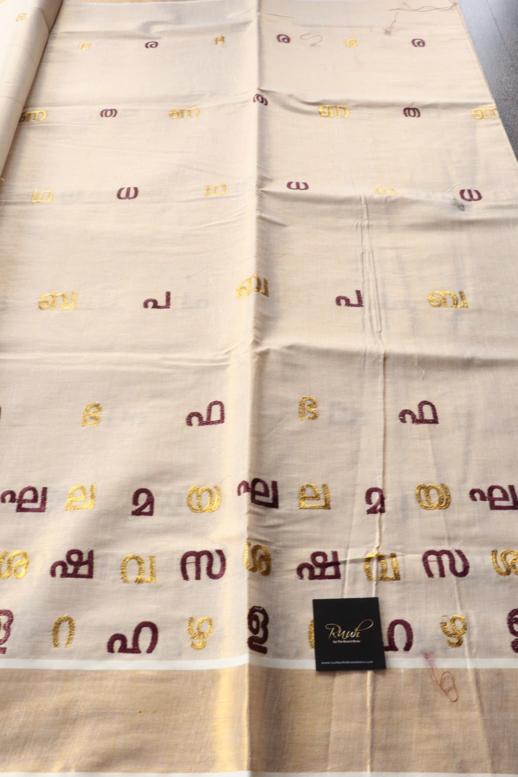 AKSHARAMALA ON KERALA TISSUE -WINE  & GOLD
