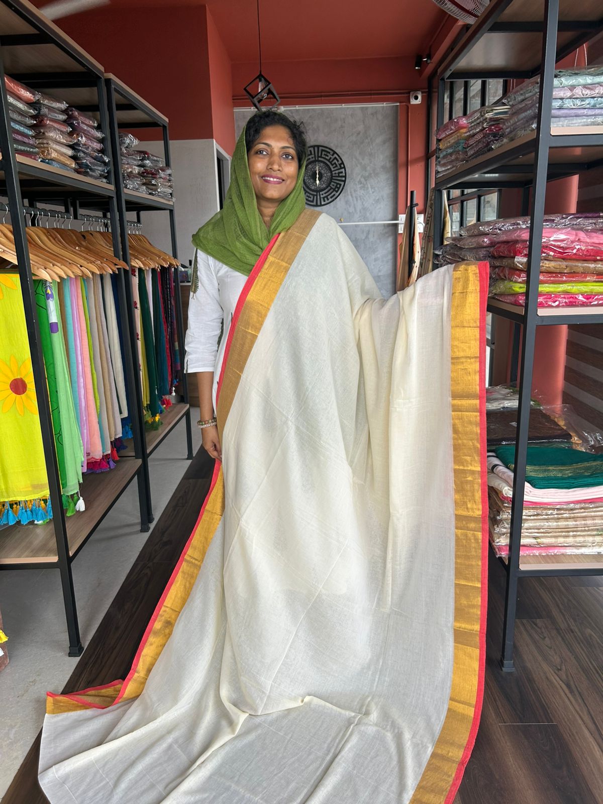 BEIGE MULMUL SAREE WITH RED EDGING