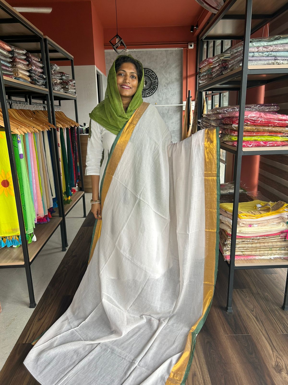 BEIGE MULMUL SAREE WITH GREEN EDGING