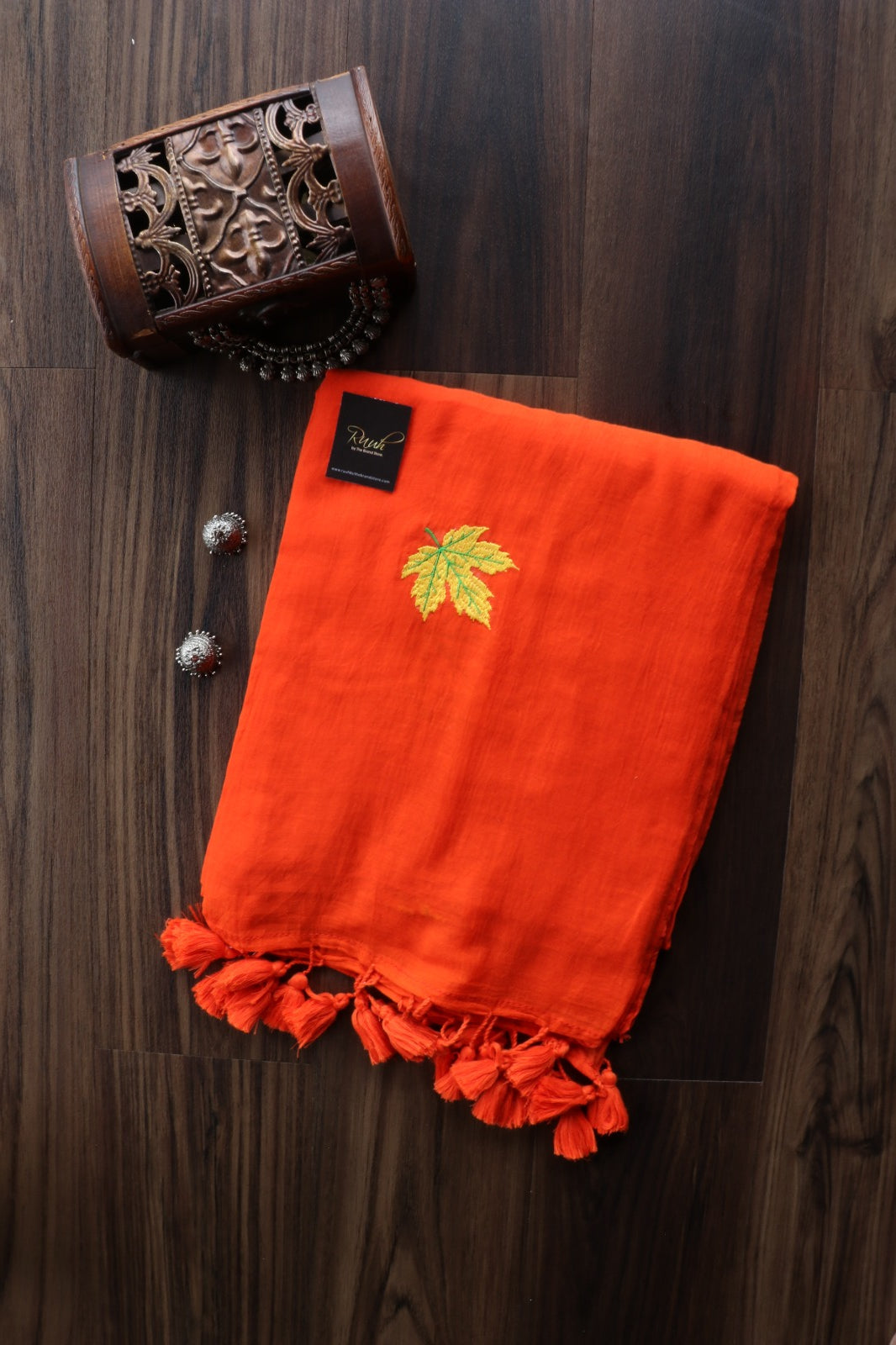 ORANGE MULMUL SAREE WITH MAPLE LEAF EMBROIDERY