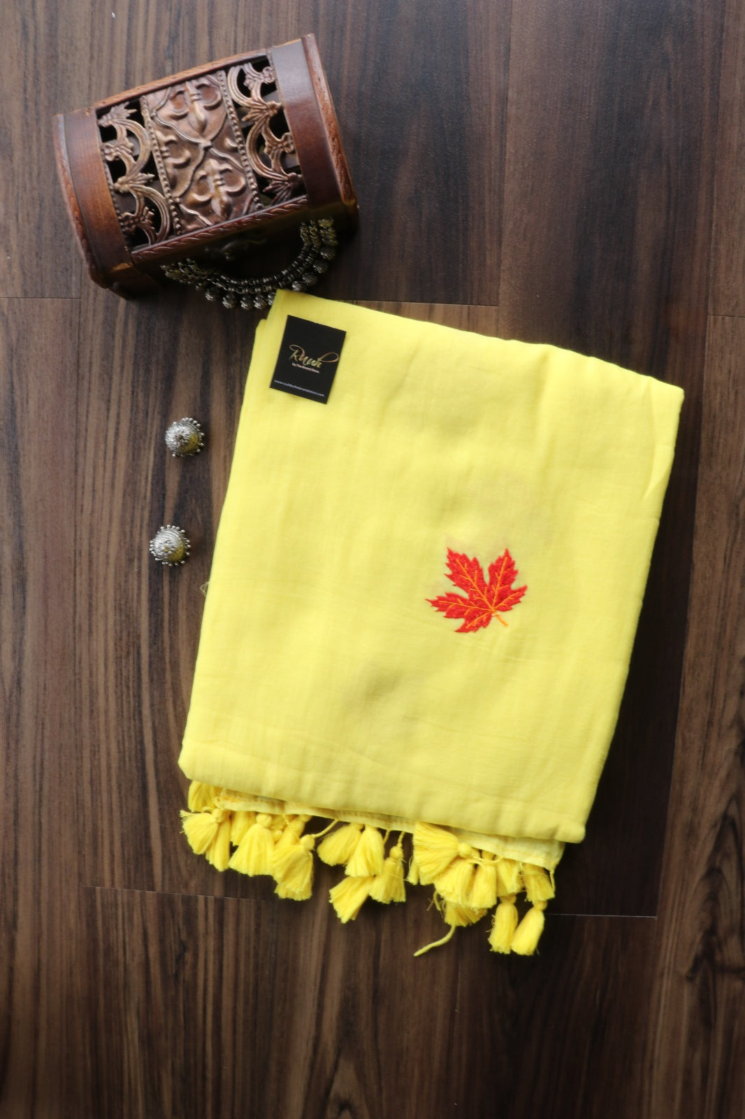 YELLOW MULMUL SAREE WITH MAPLE LEAF EMBROIDERY
