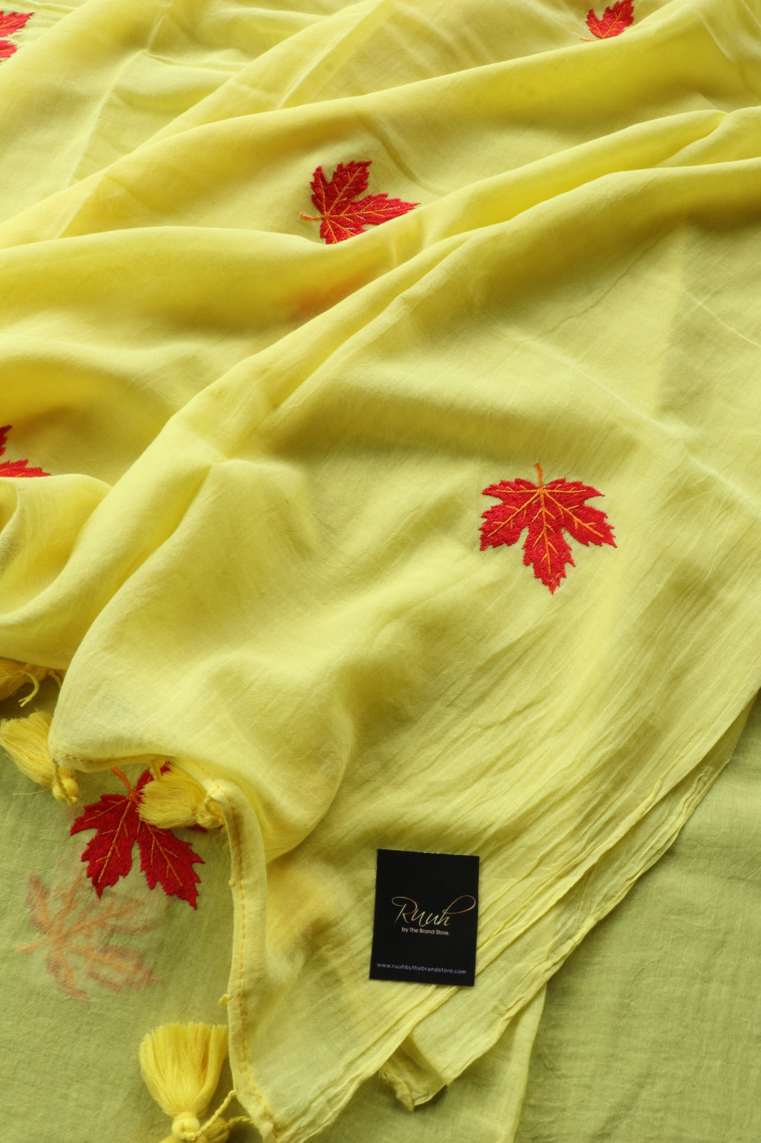 YELLOW MULMUL SAREE WITH MAPLE LEAF EMBROIDERY