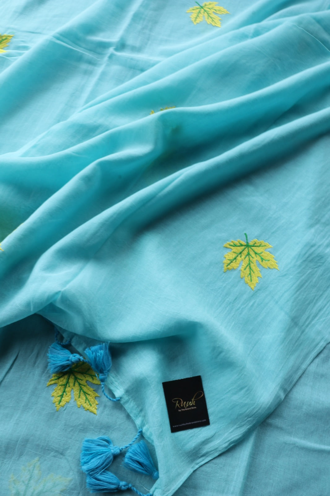 LIGHT BLUE MULMUL SAREE WITH MAPLE LEAF EMBROIDERY