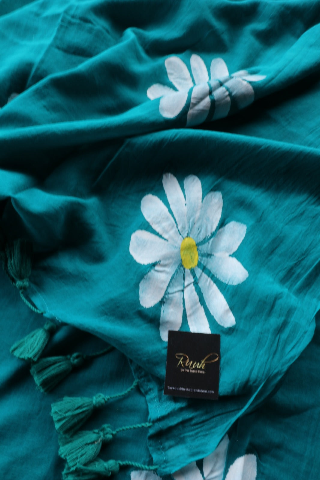 PEACOCK GREEN MULMUL SAREE WITH DAISY HANDPAINT