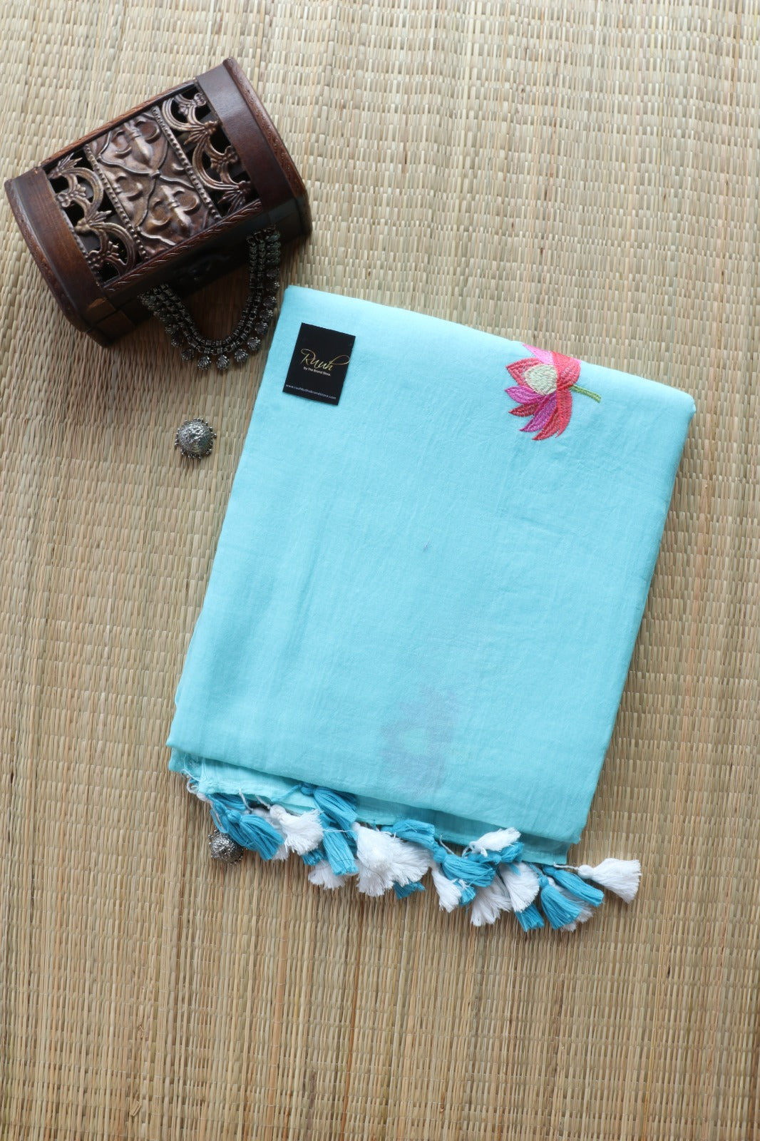 LIGHT BLUE MULMUL SAREE WITH LOTUS EMBROIDERY