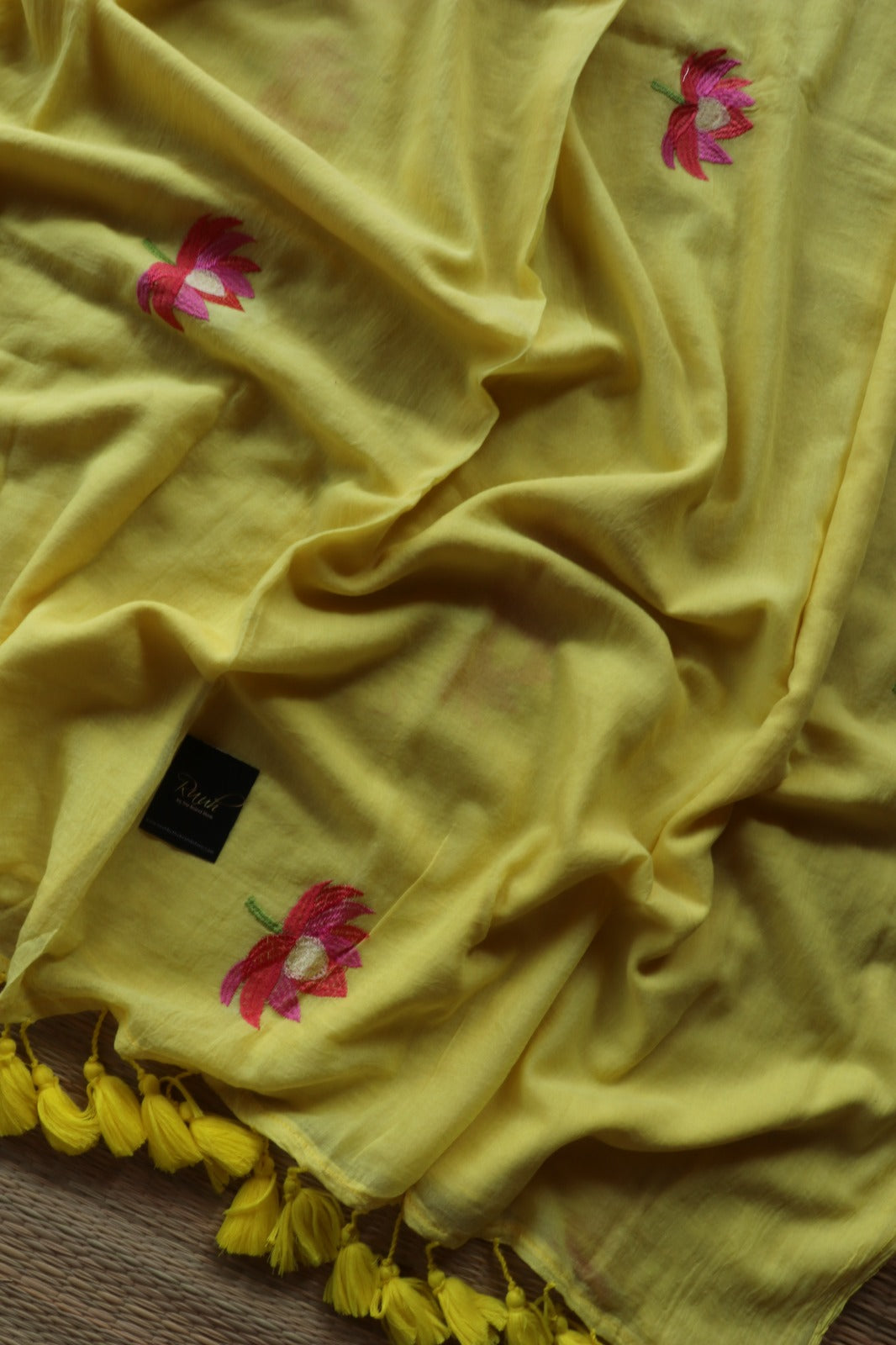 YELLOW  MULMUL SAREE WITH LOTUS EMBROIDERY