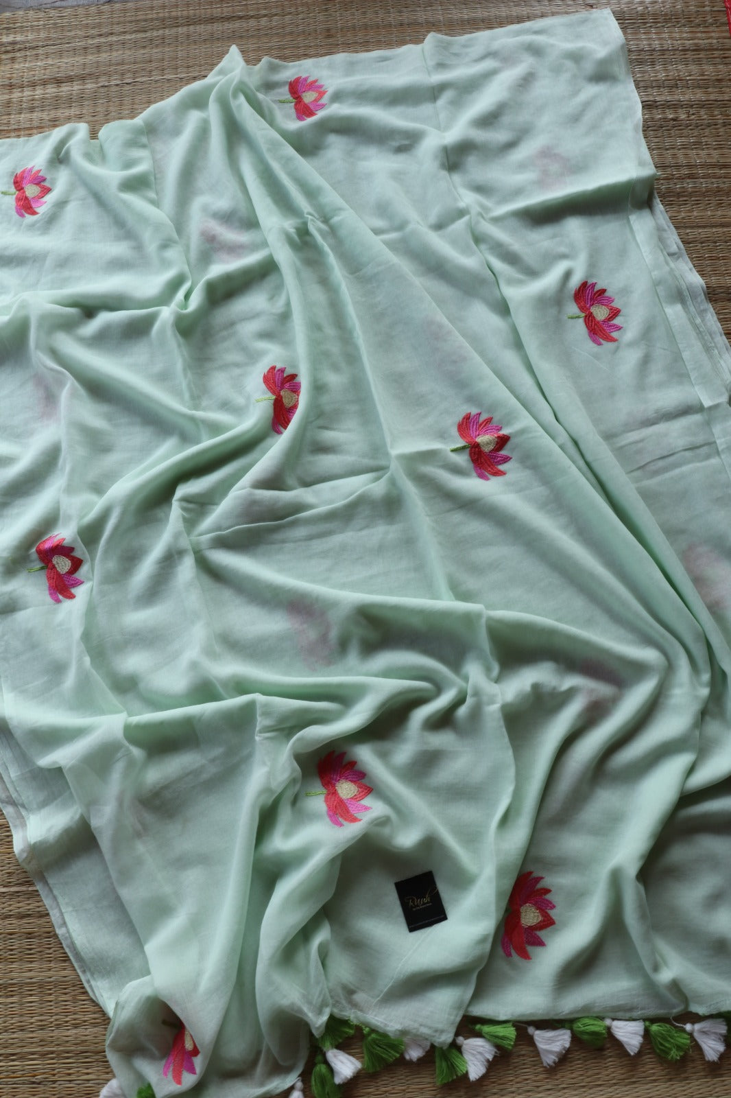 LIGHT PISTA MULMUL SAREE WITH LOTUS EMBROIDERY