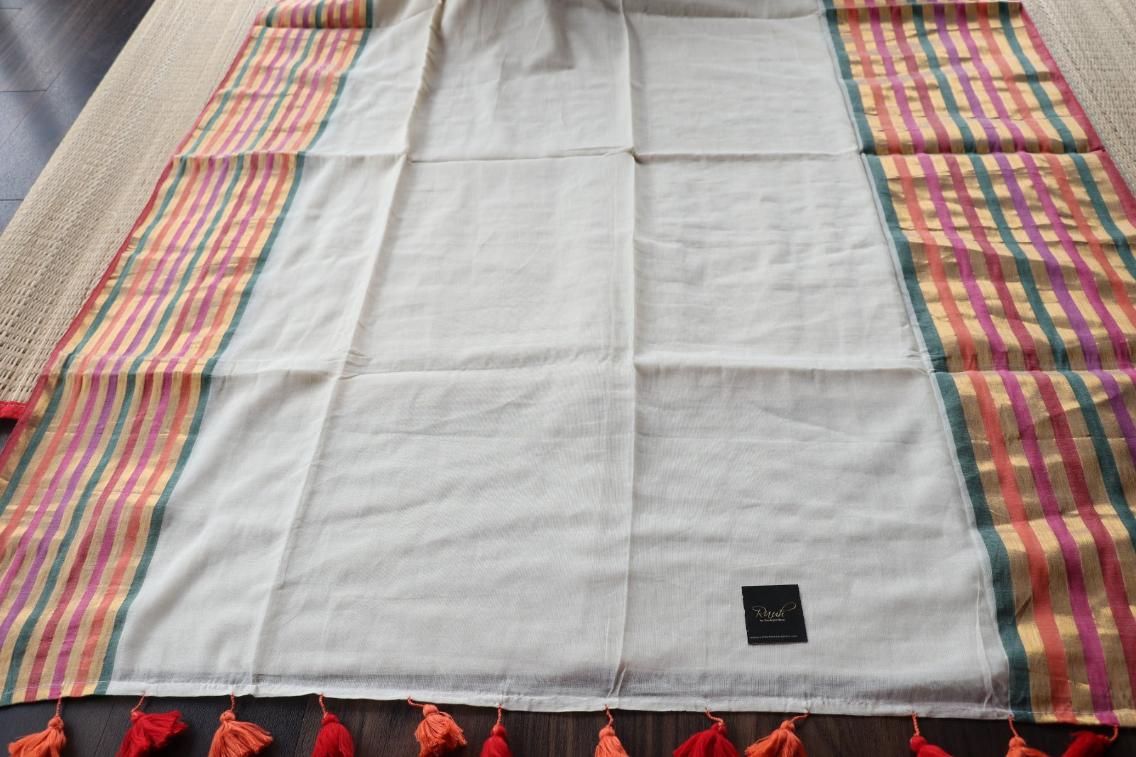 OFF WHITE MULMUL SAREE WITH MULTICOLOUR BORDER