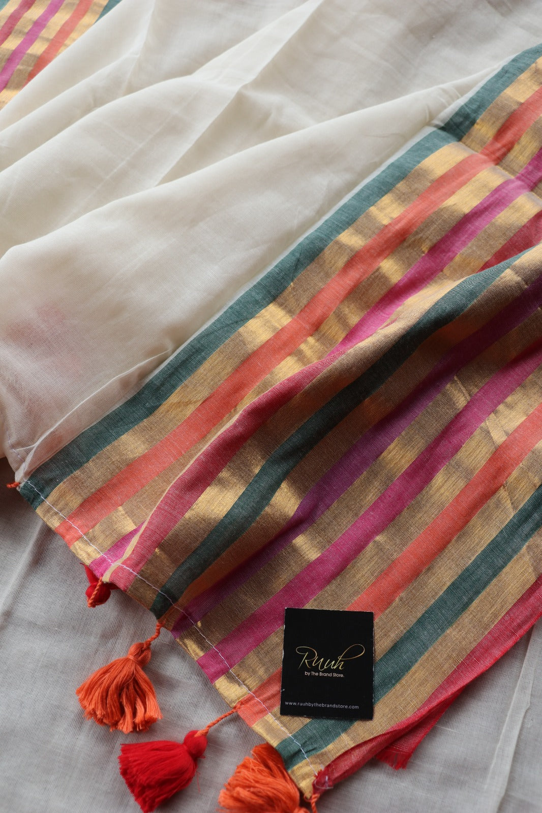 OFF WHITE MULMUL SAREE WITH MULTICOLOUR BORDER